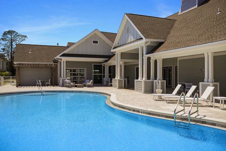 Apartments Near Santa Rosa Beach, FL- The Southern - Heated Swimming Pool with Lounge Seats, Tables, and Chairs.